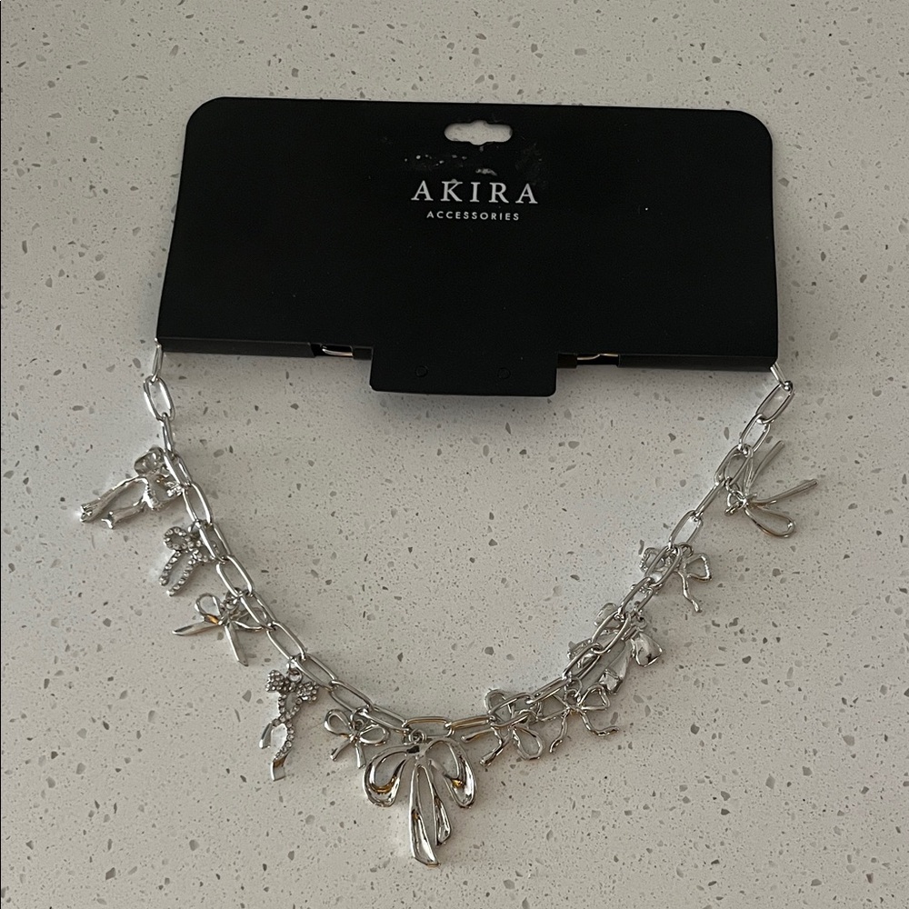AKIRA Silver Charm Necklace with Bow and Pendants